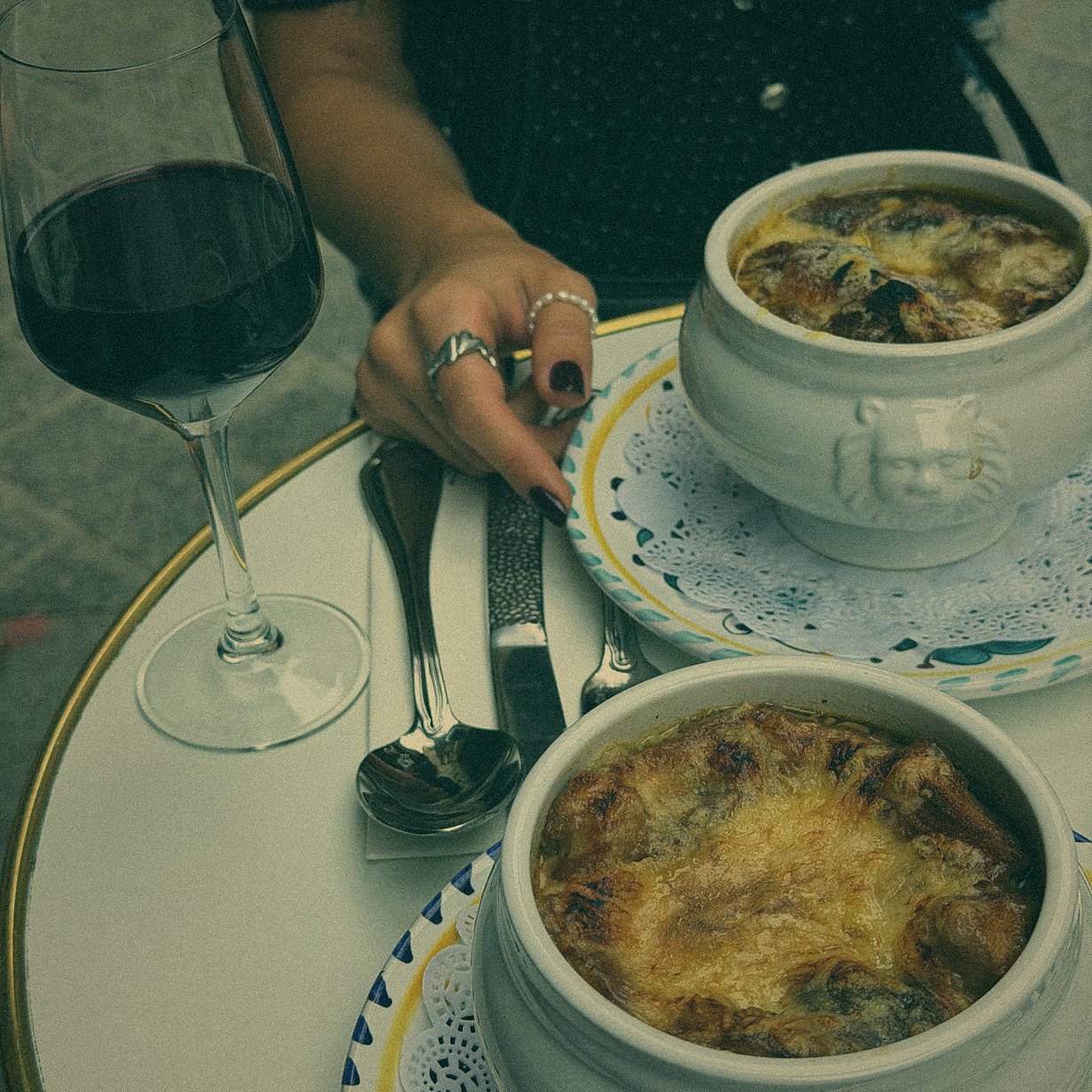 French onion soup and a glass of red wine